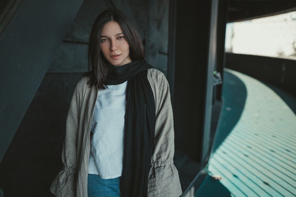 woman in gray scarf and blue shirt