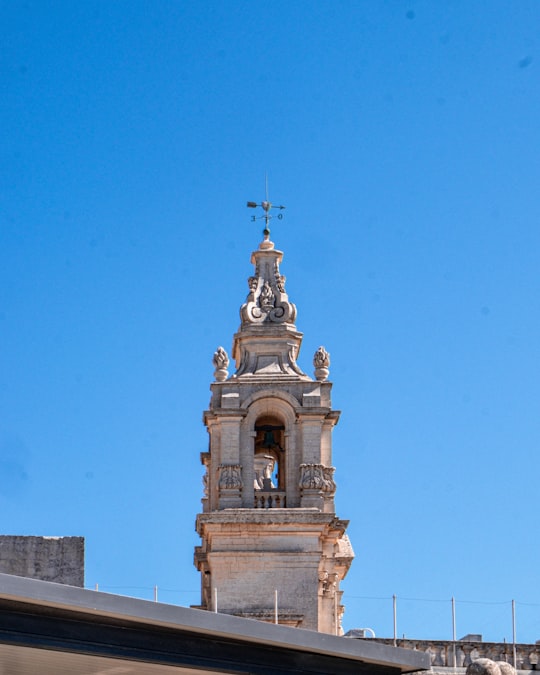 brown concrete building under blue sky during daytime in Mdina Gate Malta