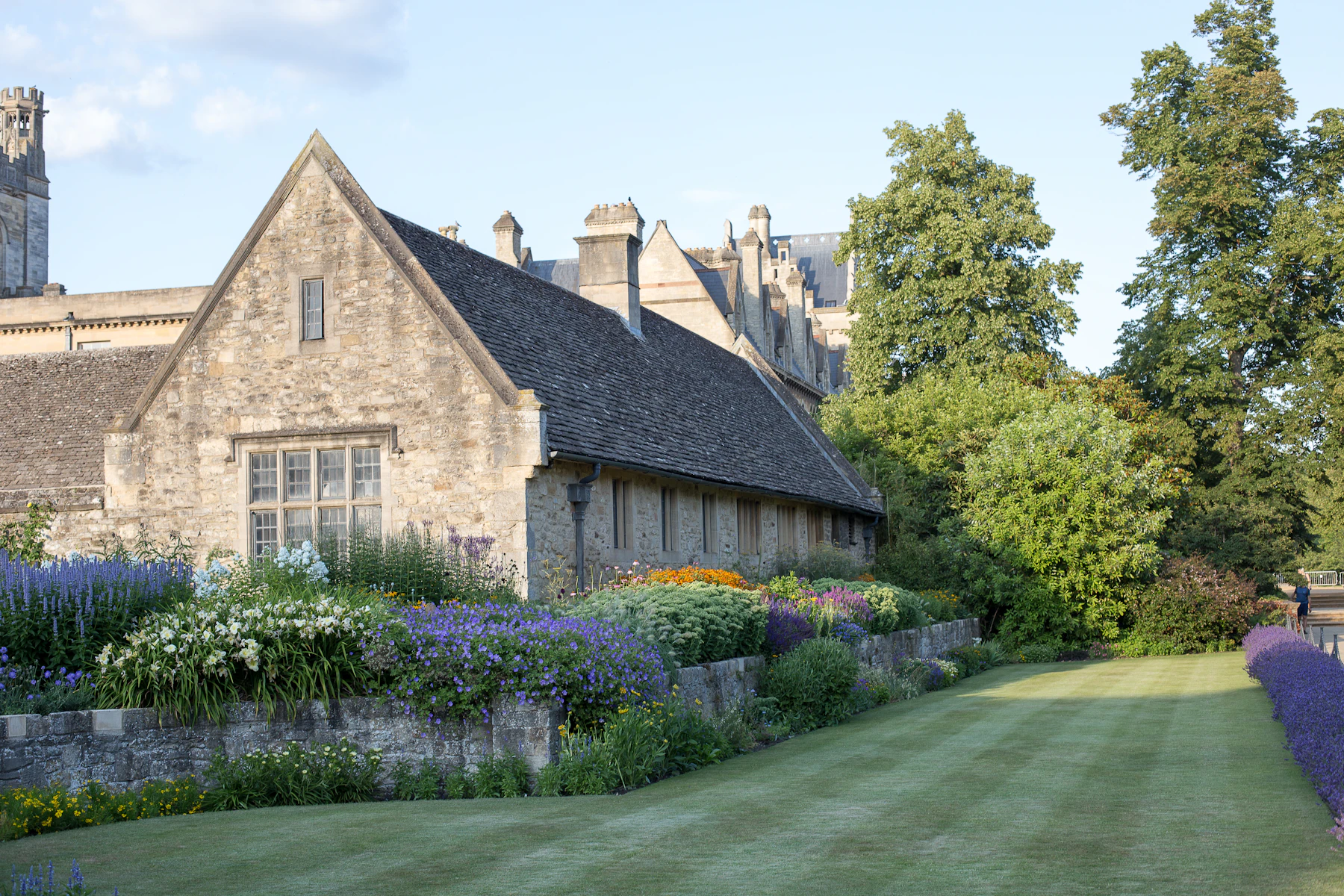 The funeral home's stone building behind a lavender garden