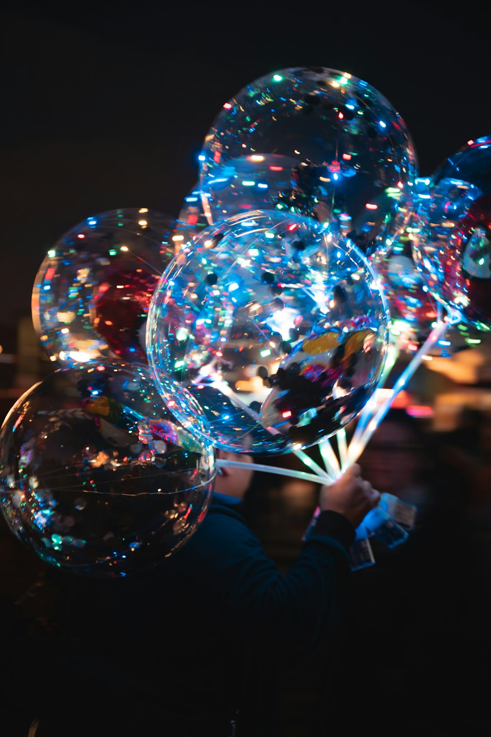 person holding clear bubble in time lapse photography