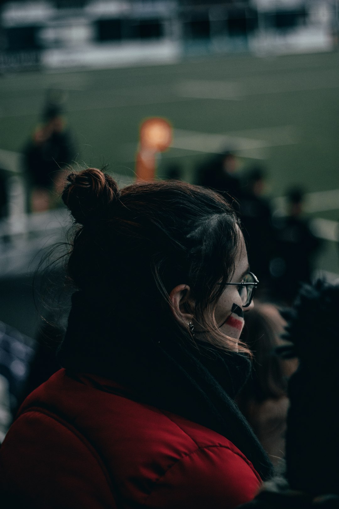 woman in red shirt wearing black framed eyeglasses