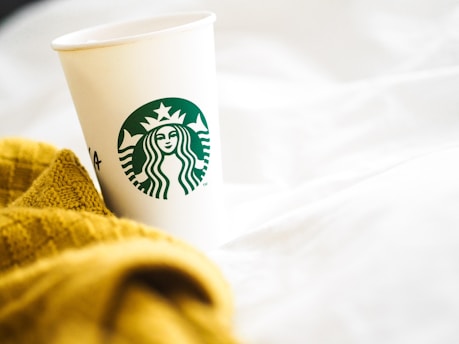 white and green starbucks cup