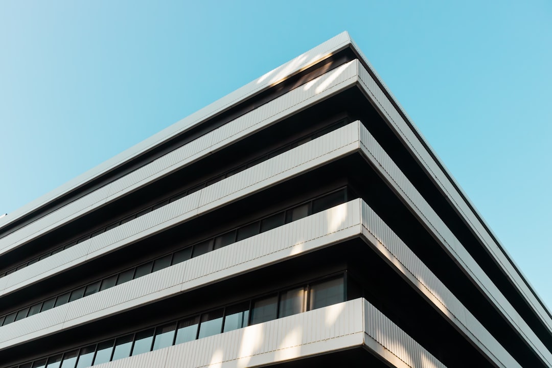 white and black concrete building under blue sky during daytime