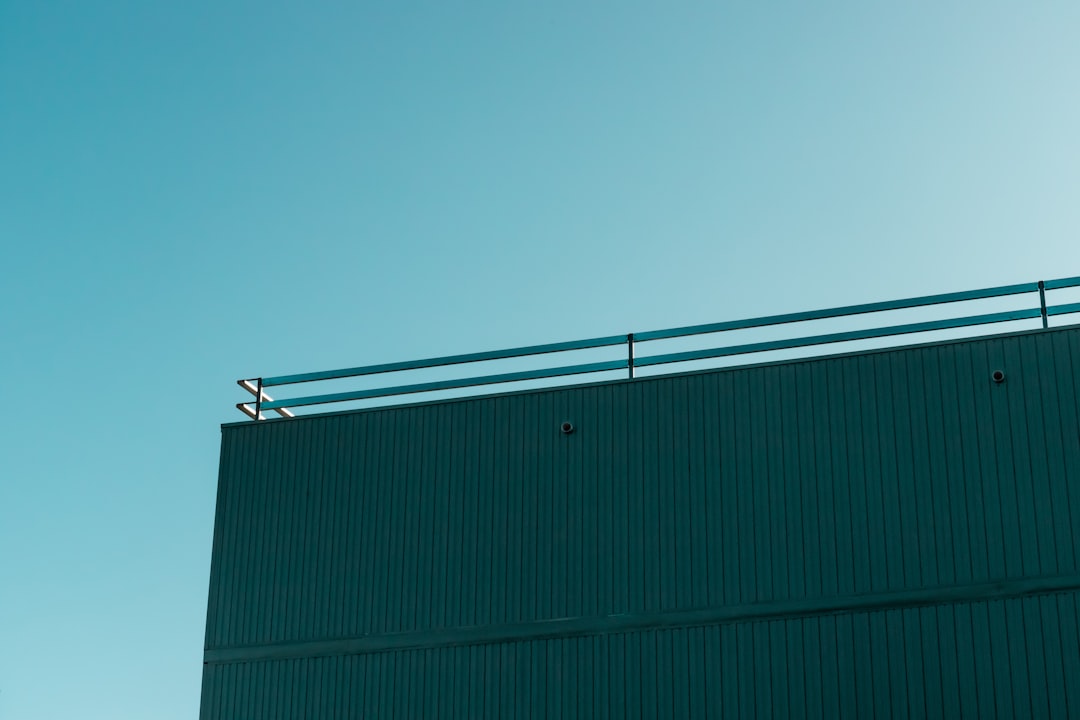 green and white building under blue sky during daytime