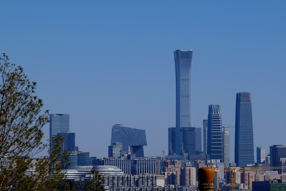 city skyline under blue sky during daytime