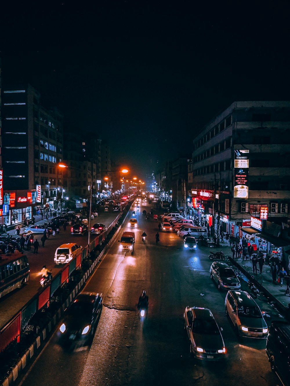 cars parked on side of the road during night time