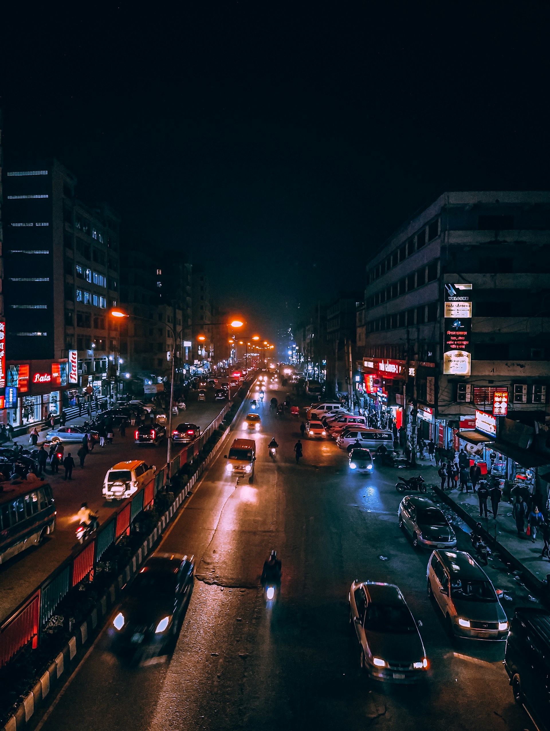 cars parked on side of the road during night time