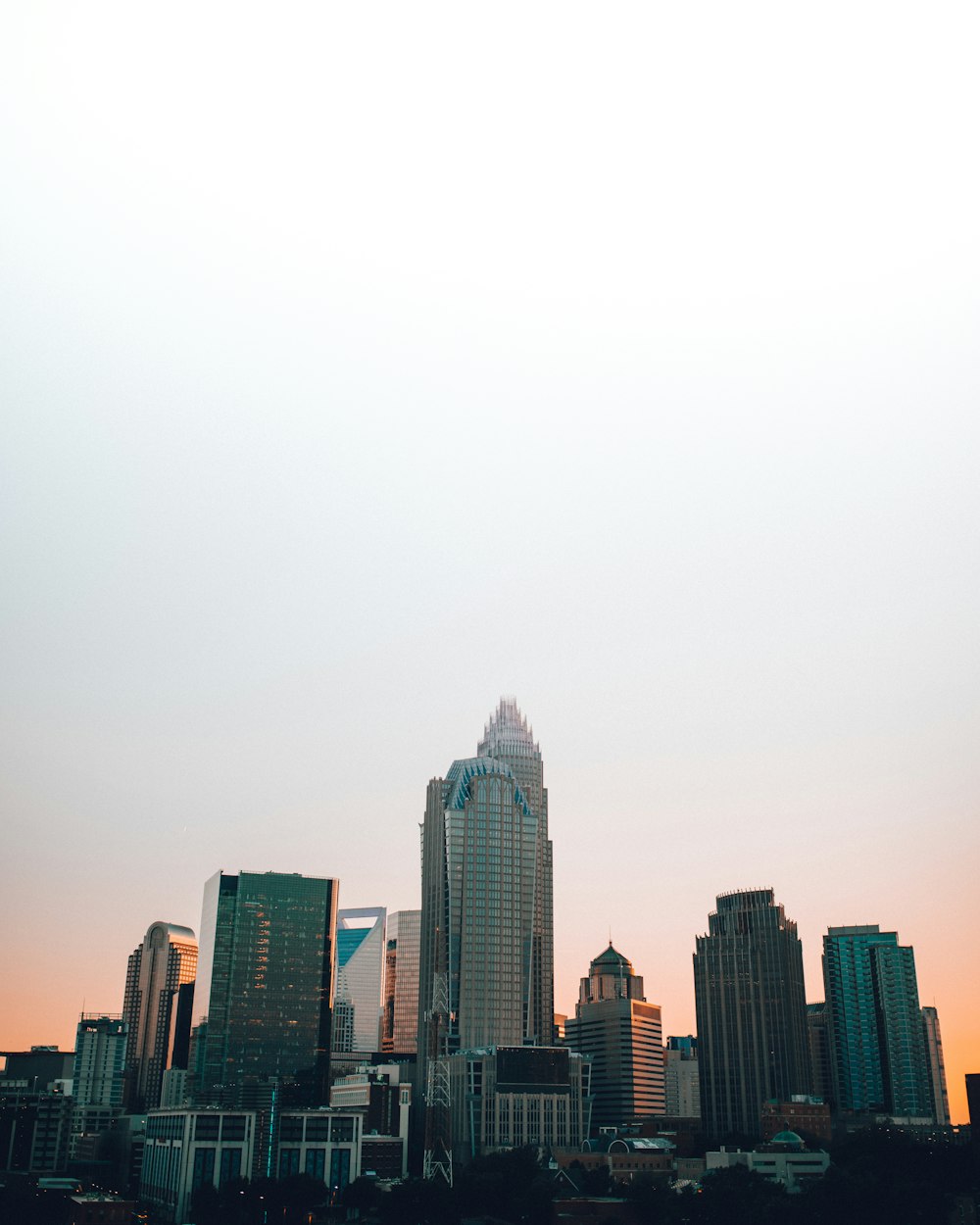 a view of a city skyline at sunset