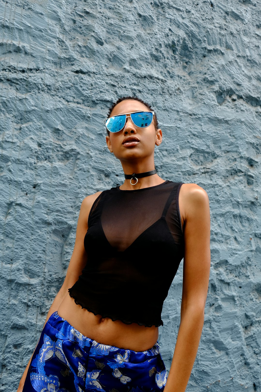 woman in black tank top wearing sunglasses