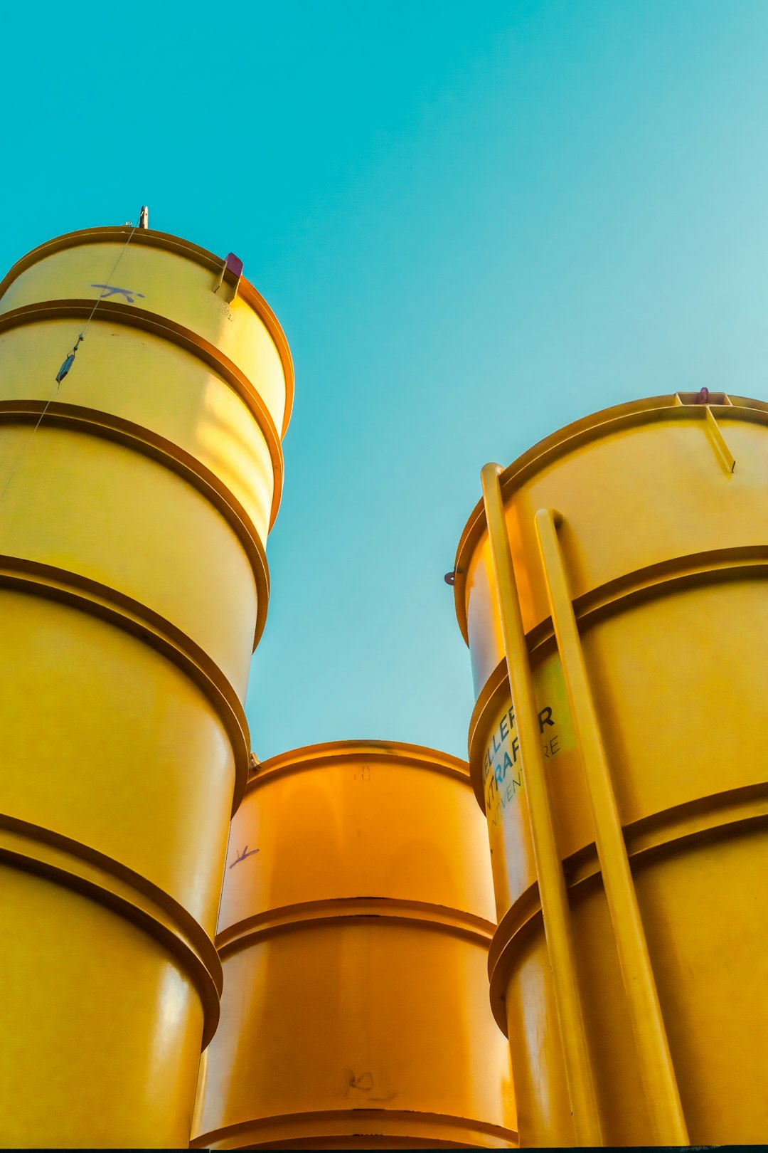 brown wooden barrels under blue sky during daytime