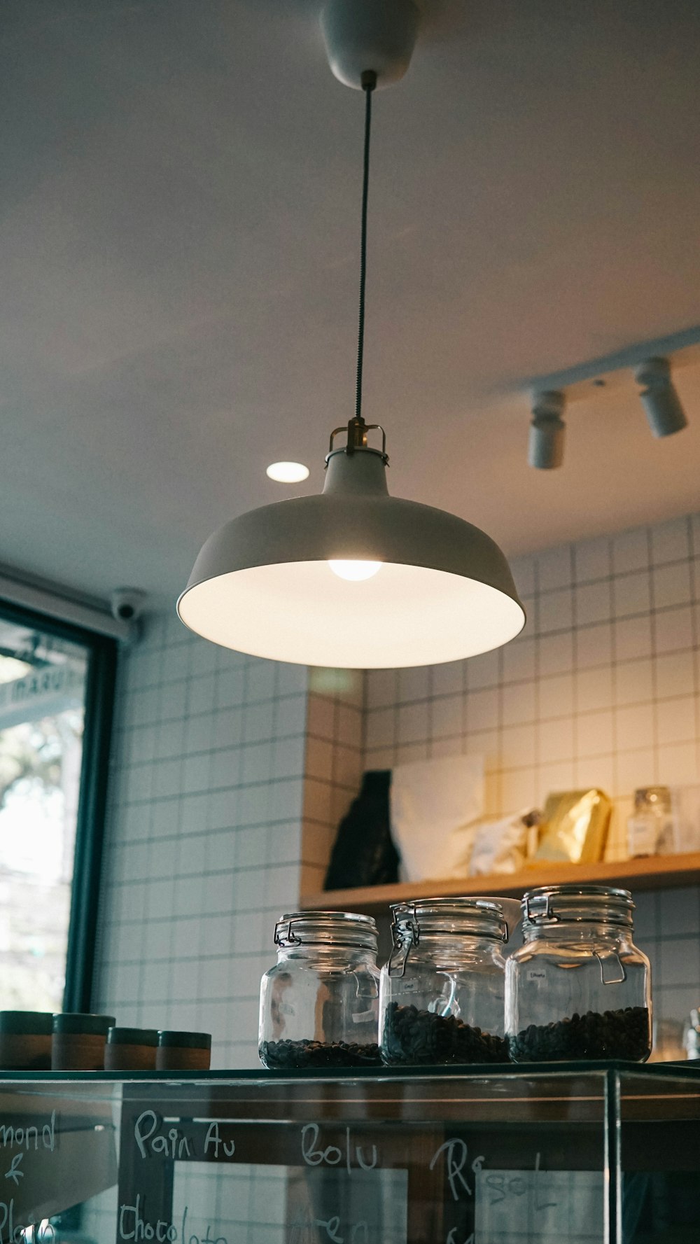 silver pendant lamp turned on in kitchen