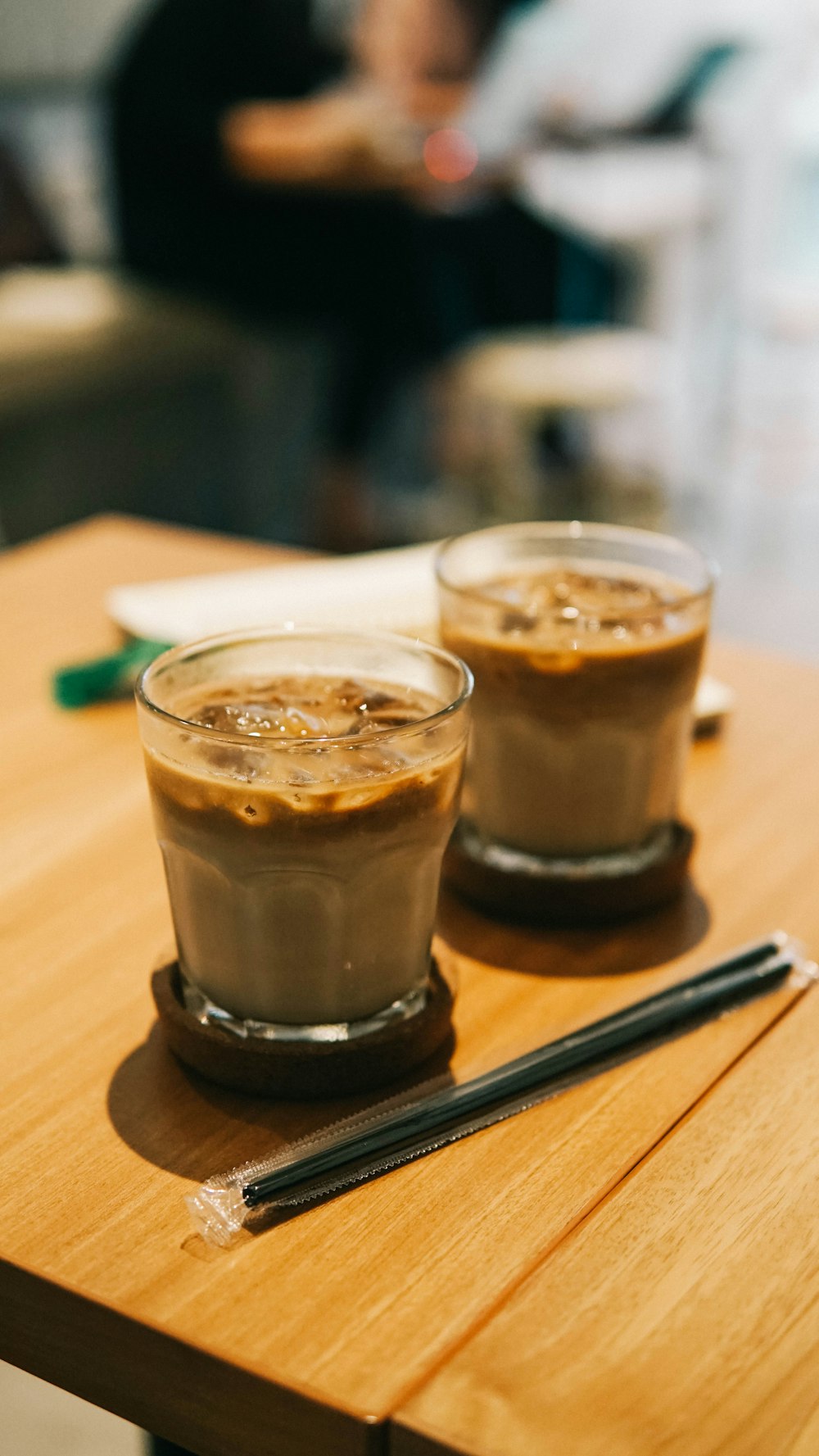 clear drinking glass with brown liquid