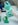 person in white long sleeve shirt holding green and white labeled can