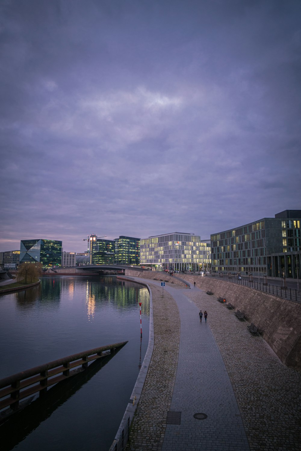 body of water near city buildings during daytime