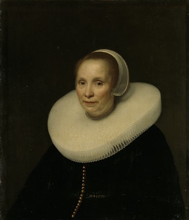baby in white hat and black shirt