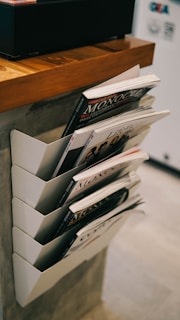 white book on brown wooden table