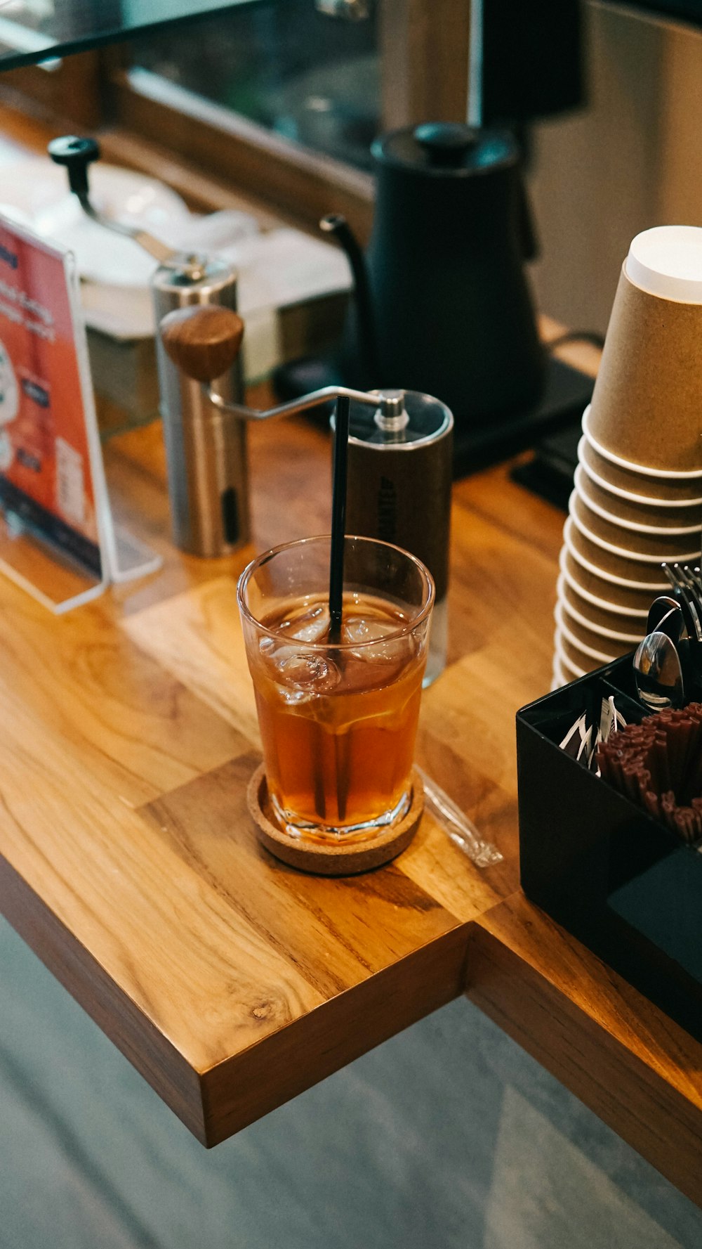 clear drinking glass with brown liquid