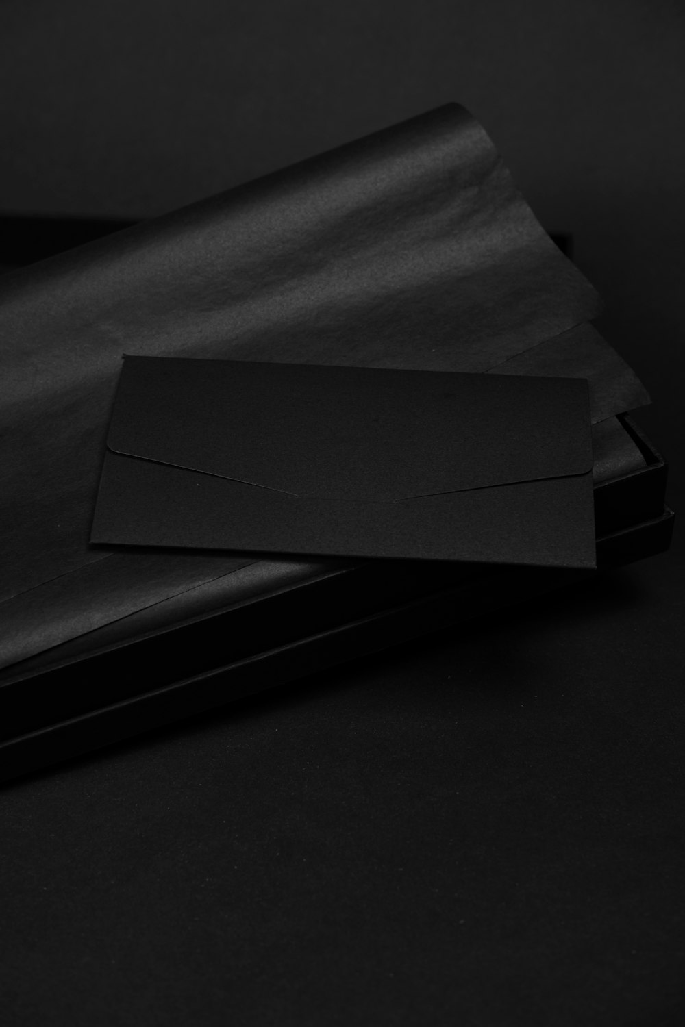 white paper on black surface