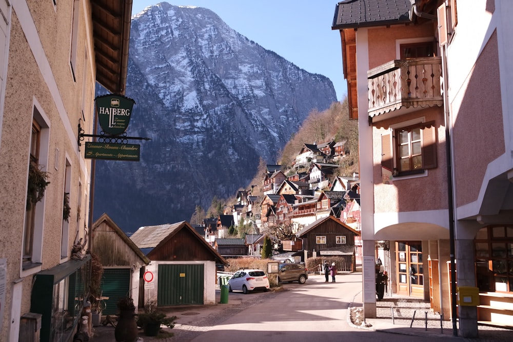 brown and white concrete building near mountain during daytime