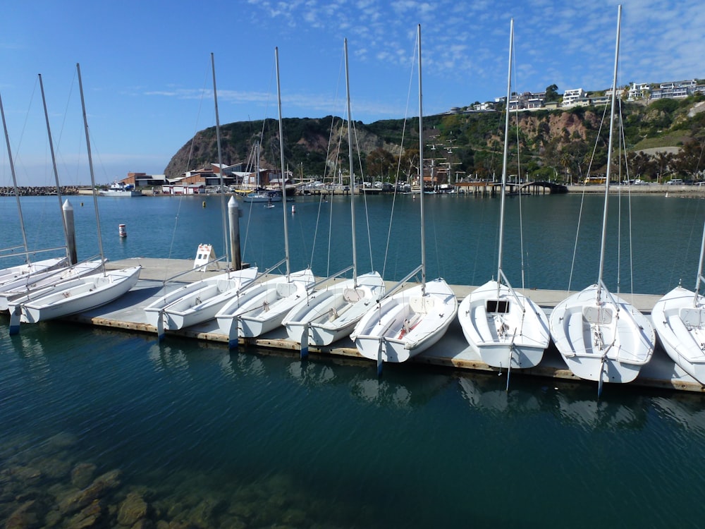 white boats on body of water during daytime