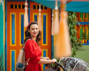 woman in red and blue long sleeve shirt sitting on black wheelchair