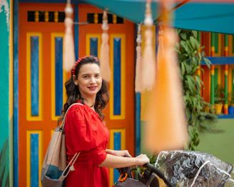 woman in red and blue long sleeve shirt sitting on black wheelchair