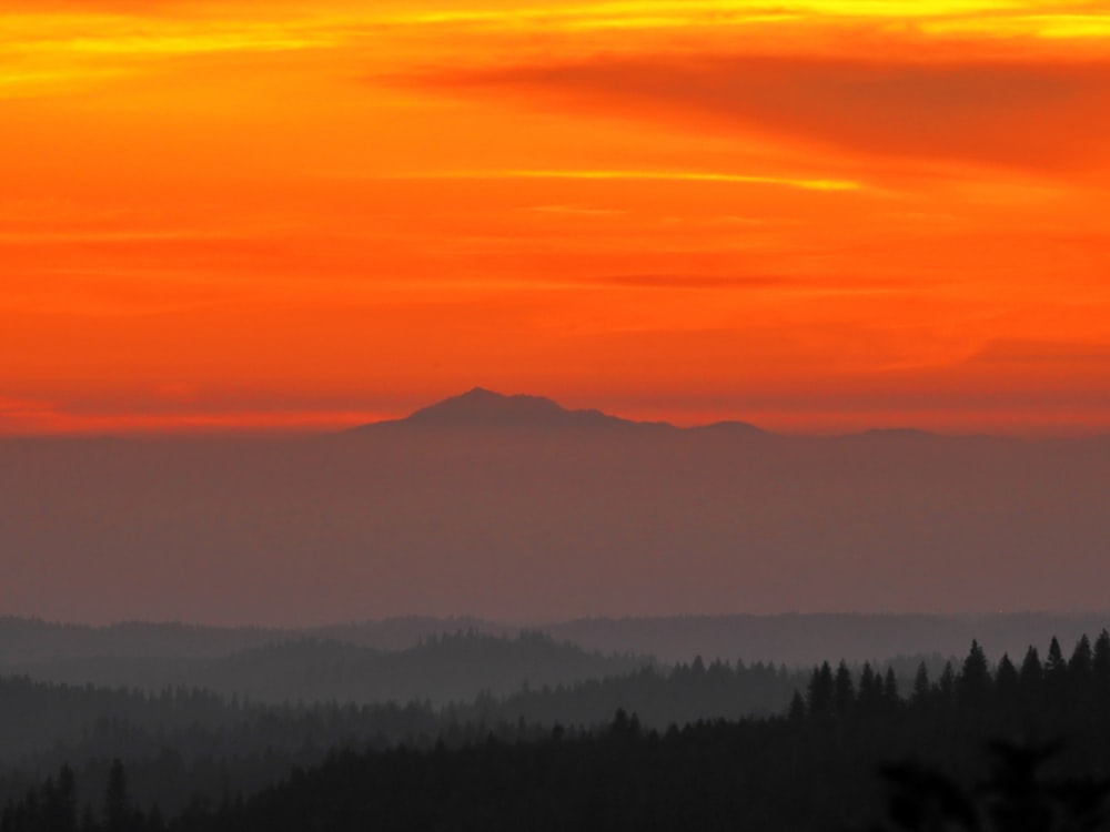 silhouette of mountain during sunset