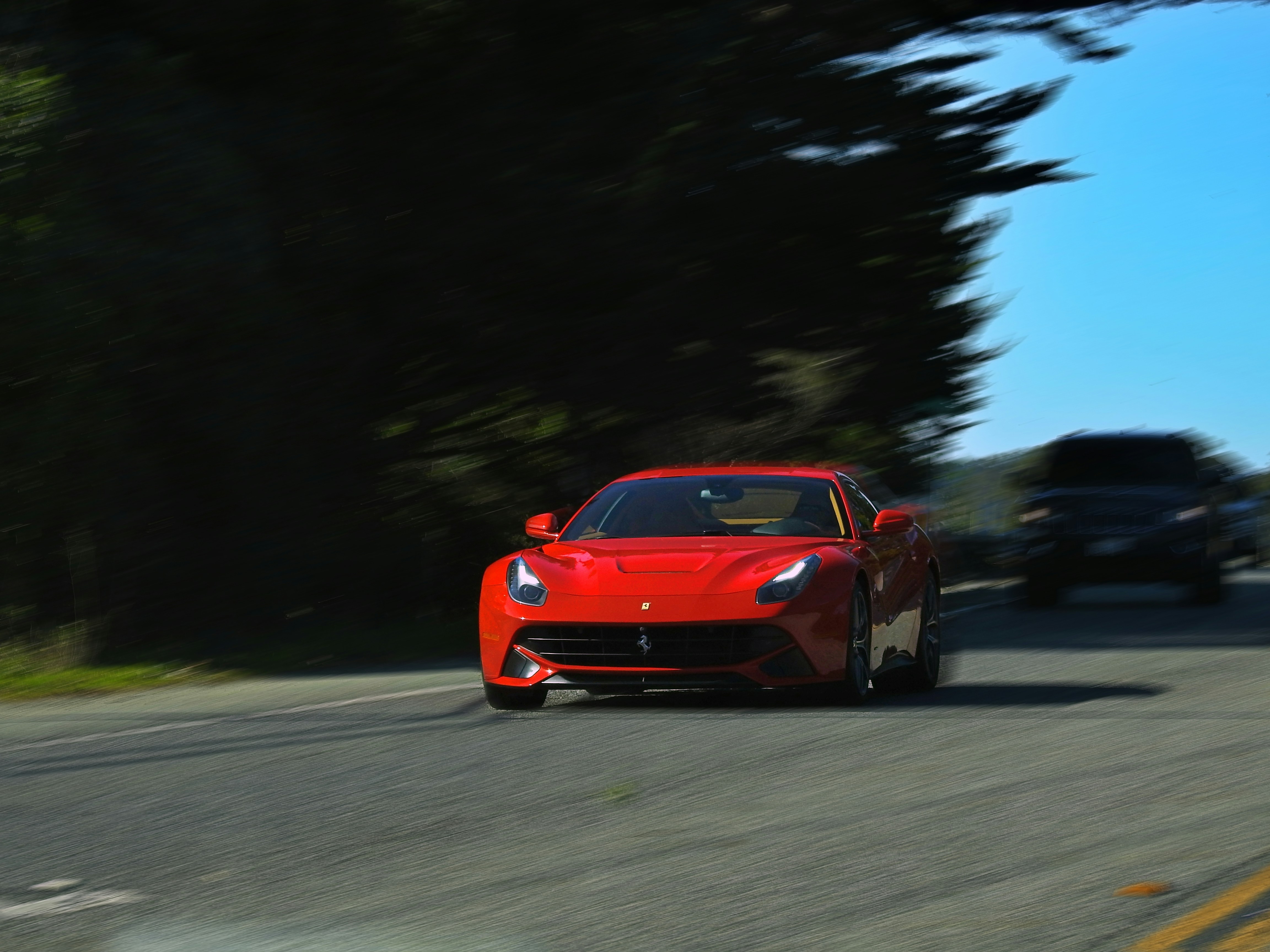 red ferrari 458 italia on road during daytime