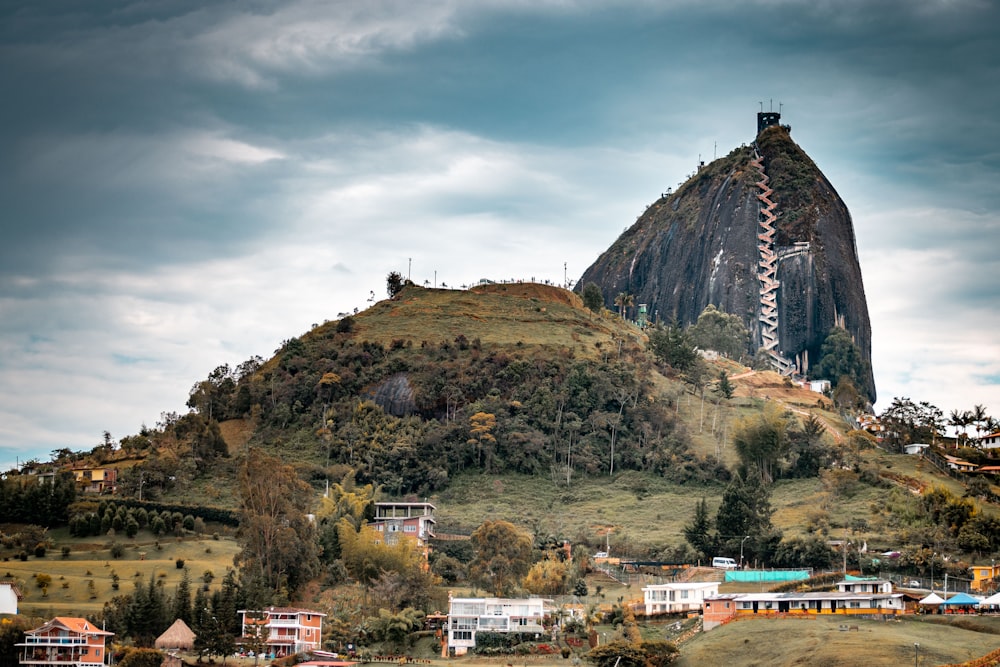 green and brown mountain under cloudy sky during daytime