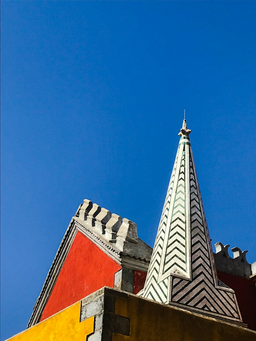 red and white concrete building under blue sky during daytime