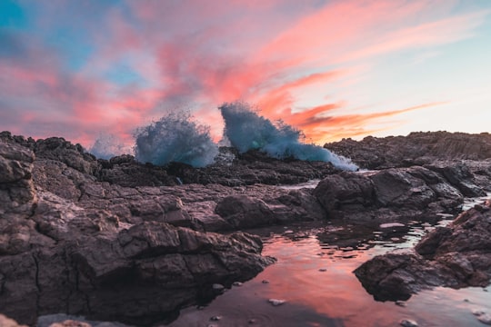 ocean waves crashing on rocks during sunset in Antibes France