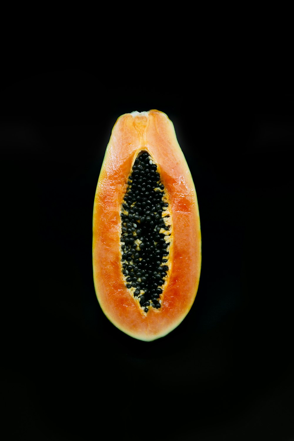 sliced tomato with black background