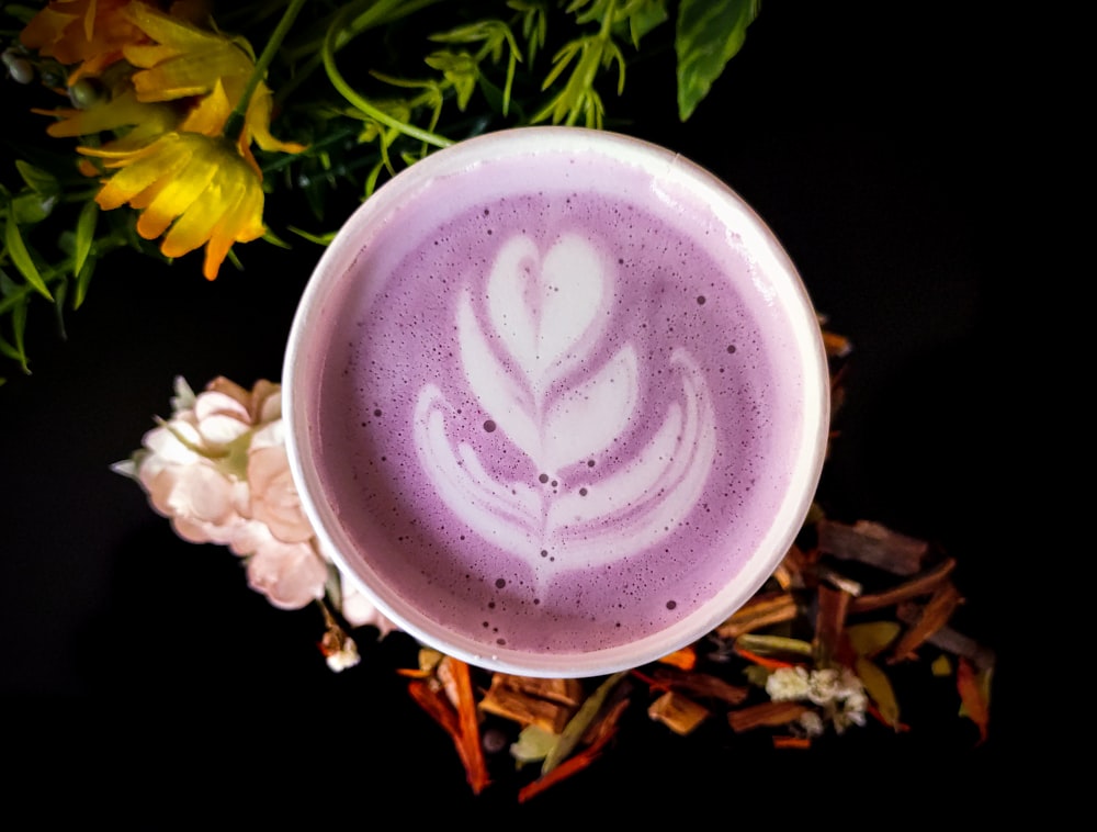 white ceramic cup with heart design