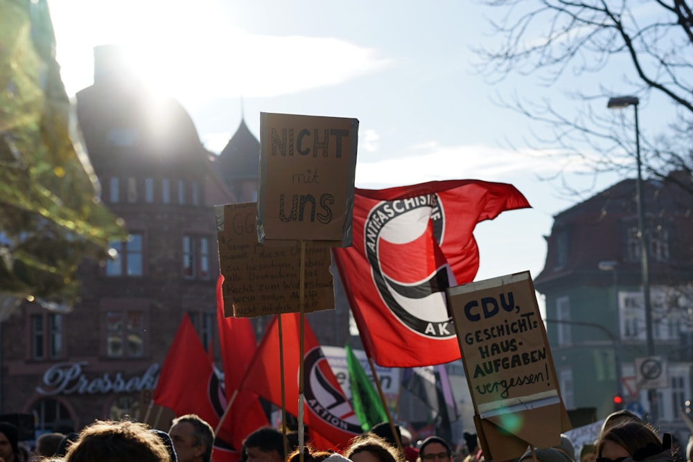 people holding flags during daytime