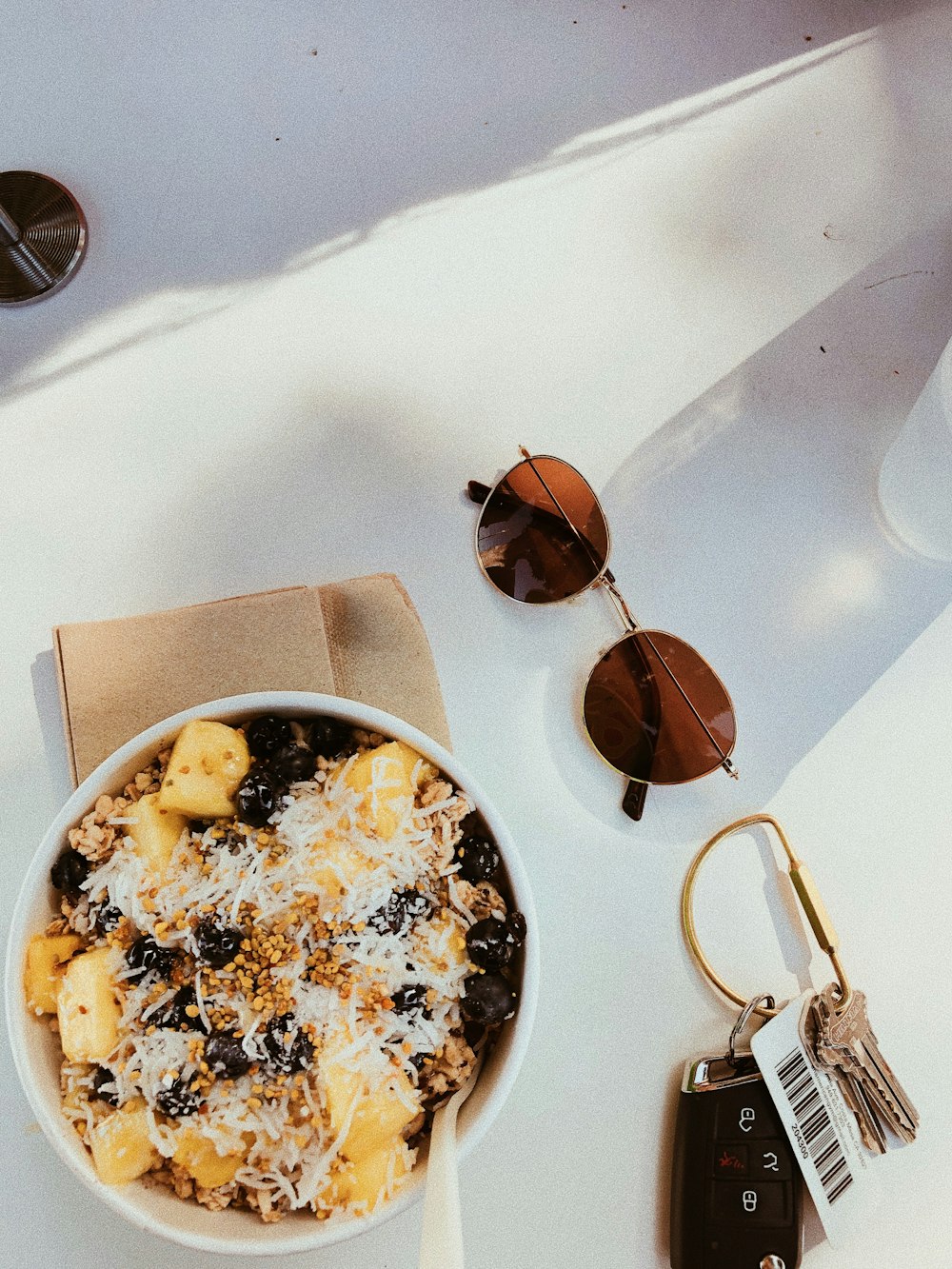 brown sunglasses on white ceramic plate