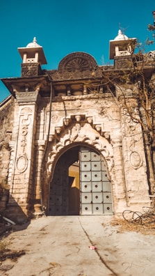 A portal-like gateway framed by ancient symbols and digital motifs.