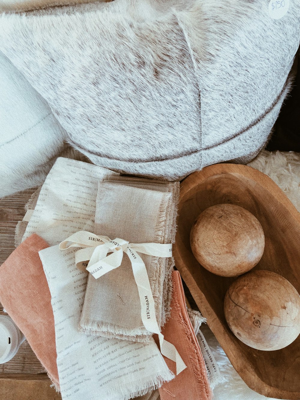 brown wooden bowl on white textile