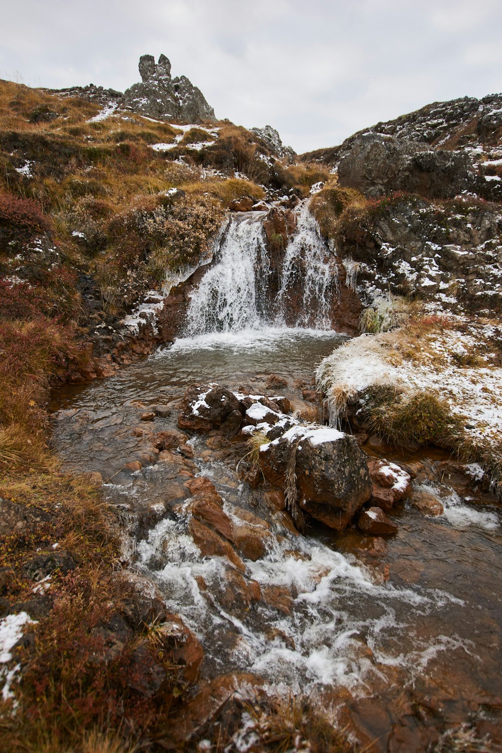 water falls on rocky mountain