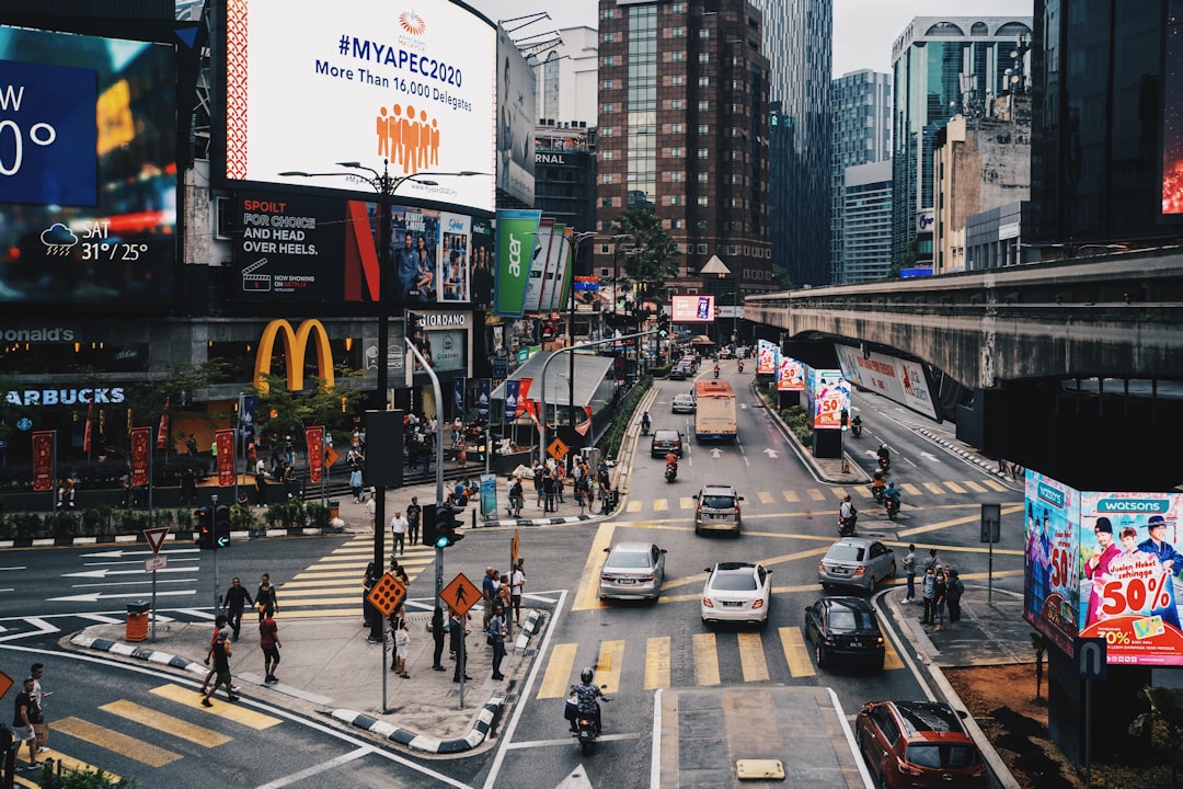 people crossing on pedestrian lane during daytime