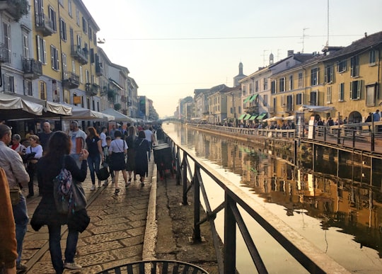 people walking on sidewalk during daytime in Spritz Navigli Italy