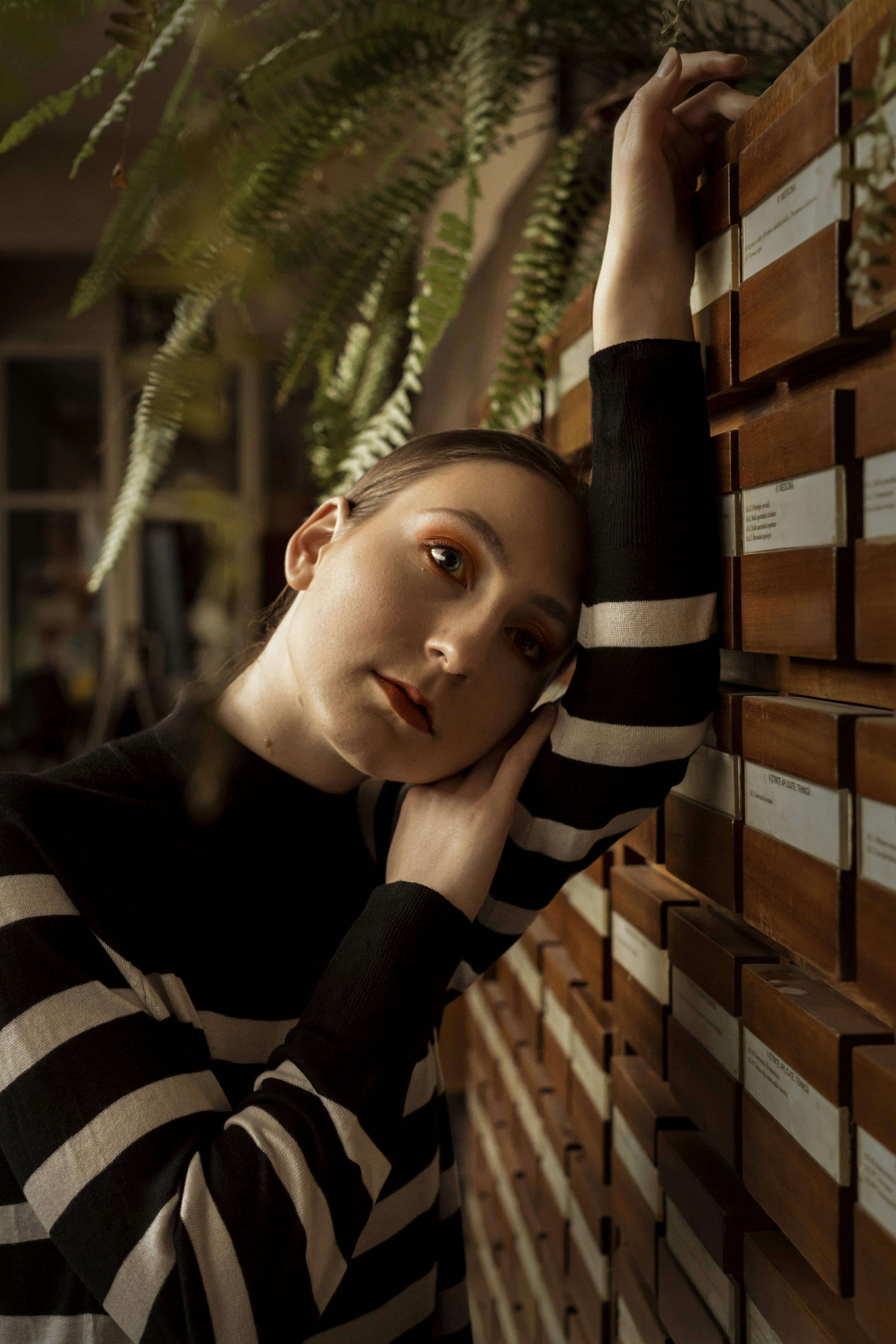 woman in black and white striped long sleeve shirt