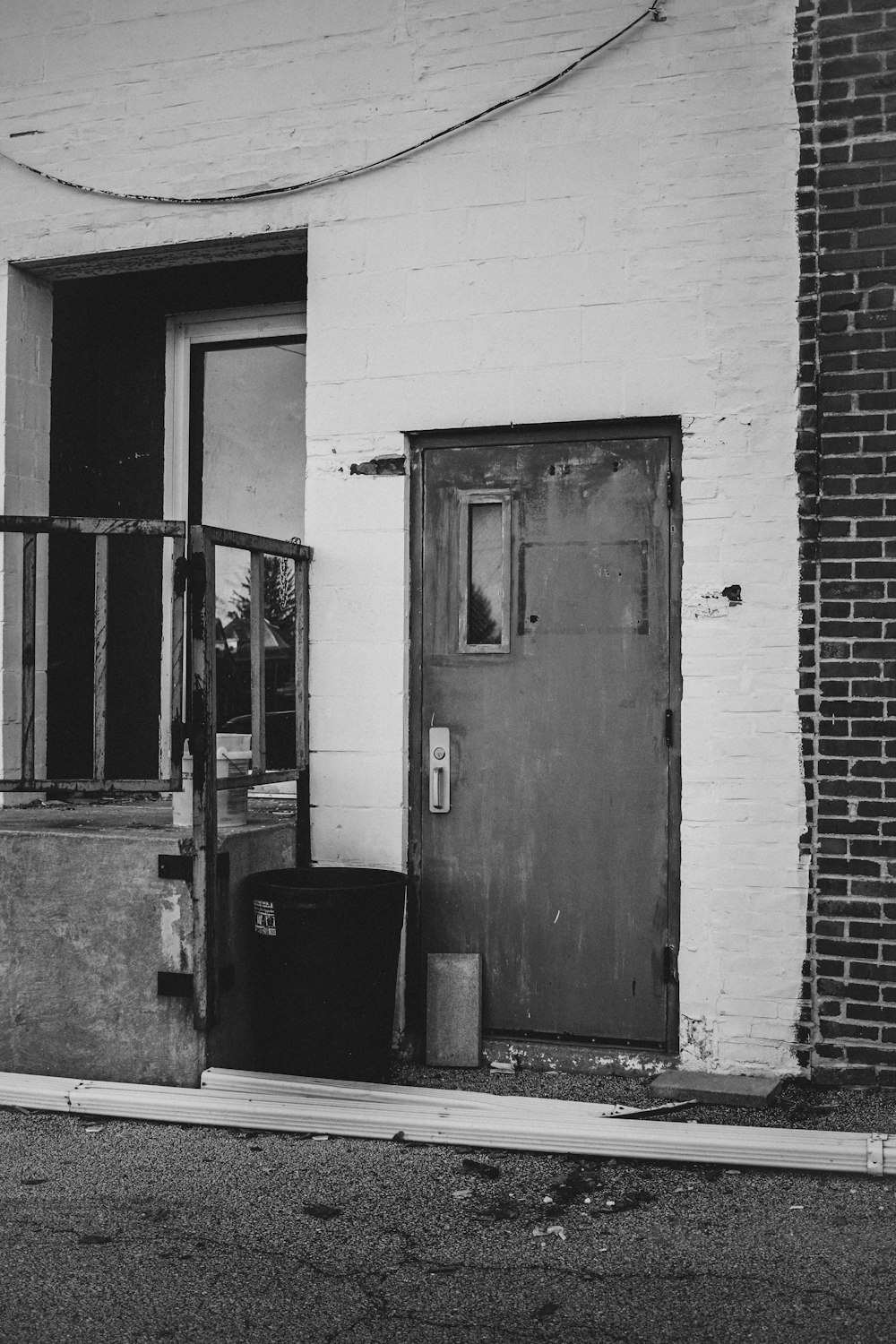 grayscale photo of closed door