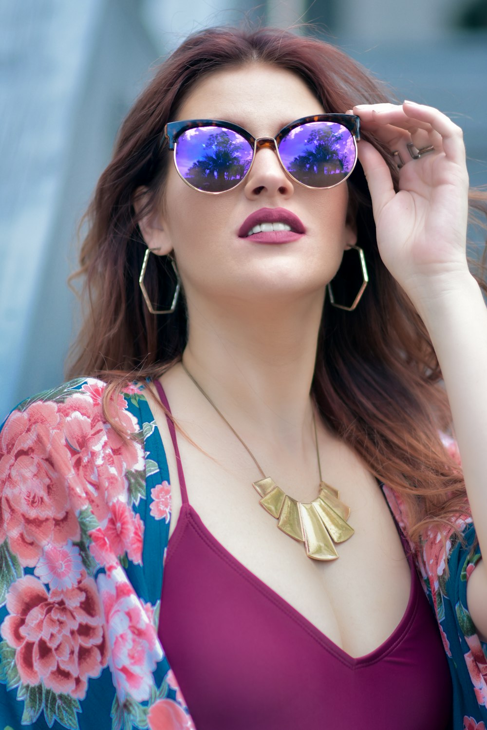 woman in blue and pink bikini wearing blue sunglasses