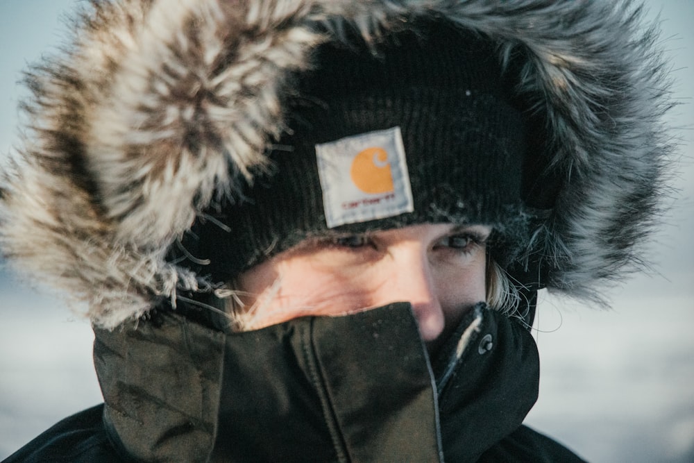 person in black and brown fur jacket