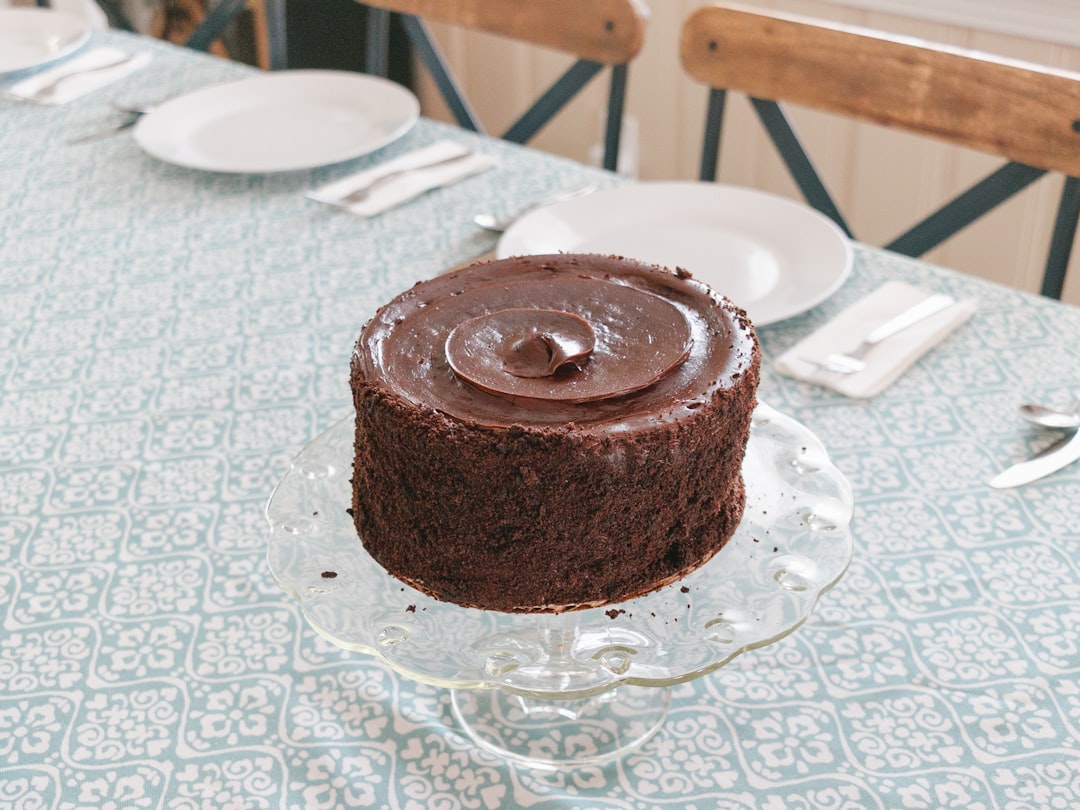 chocolate cake on white table cloth