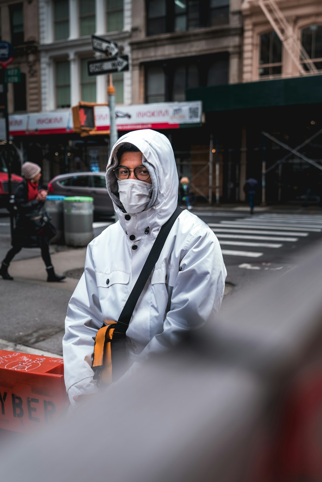 person in white long sleeve shirt wearing white mask