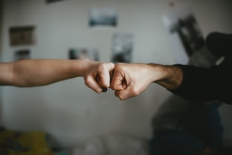 person holding friends hand