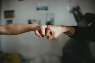 Close-up of hands shaking, symbolizing trust and partnership in business insurance.