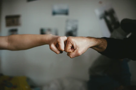 Close-up of a client handshake symbolizing trust and partnership.