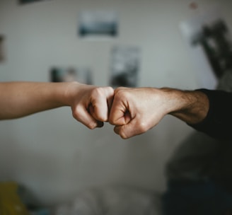 person holding babys hand